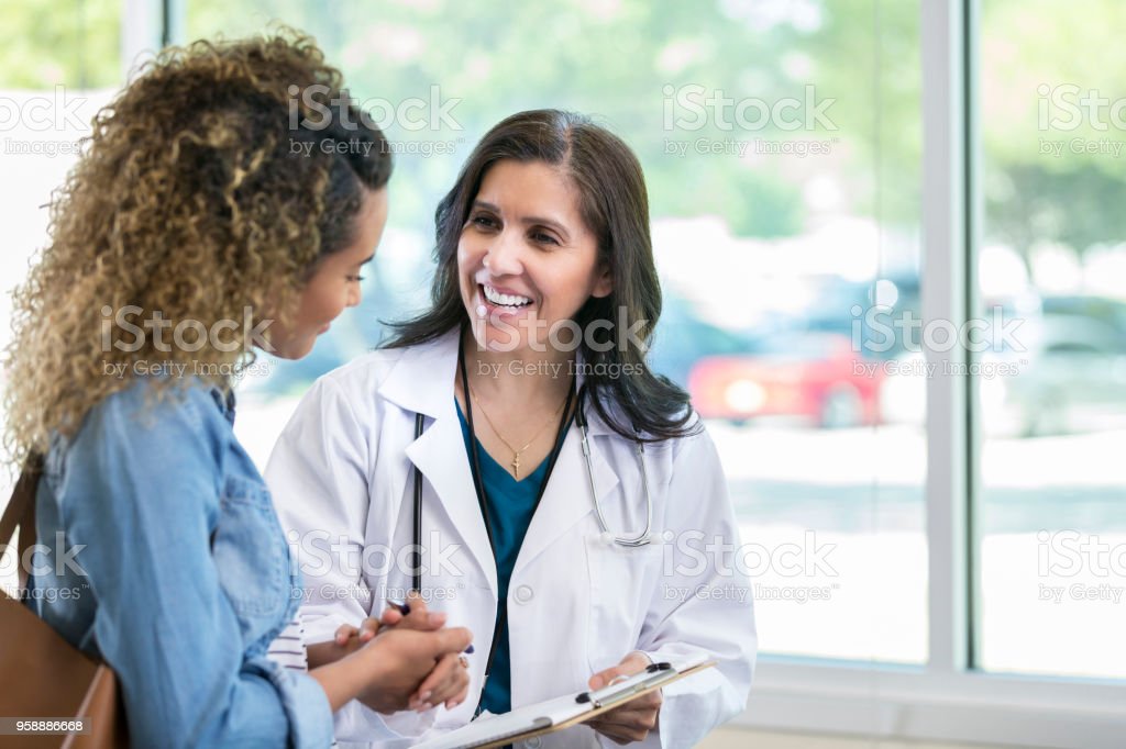 A female doctor consulting with a patient.