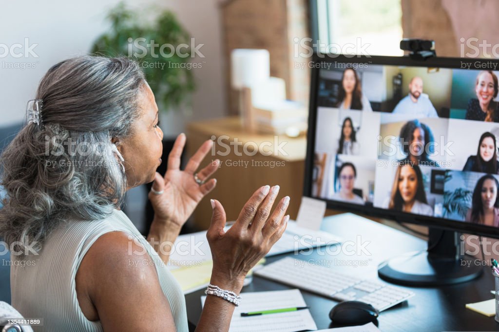 A woman participating in an online presentation.