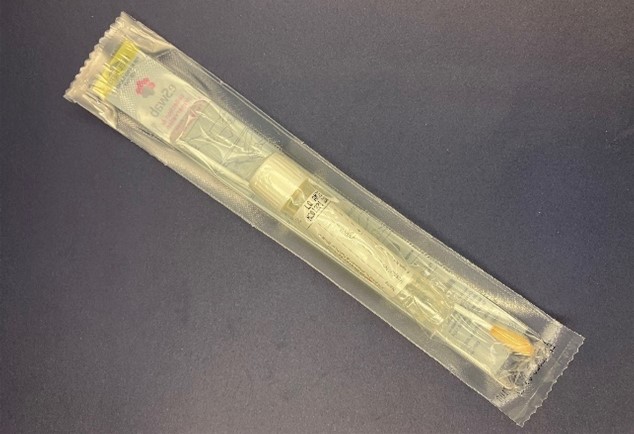 An overhead image of a sealed, unopened Copan Eswab™ Regular Size Nylon flocked swab with liquid Amies Copan for Neisseria gonorrhoeae clinical specimen collection.jpg