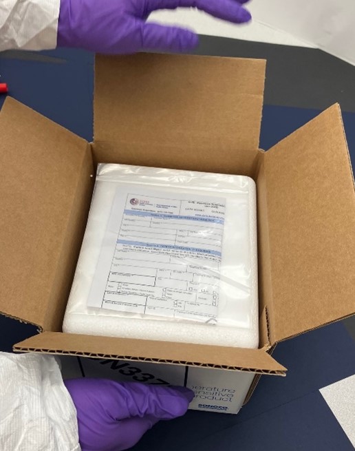 Lab Technician handling a package with specimens