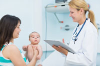 A woman and child talking with a healthcare provider