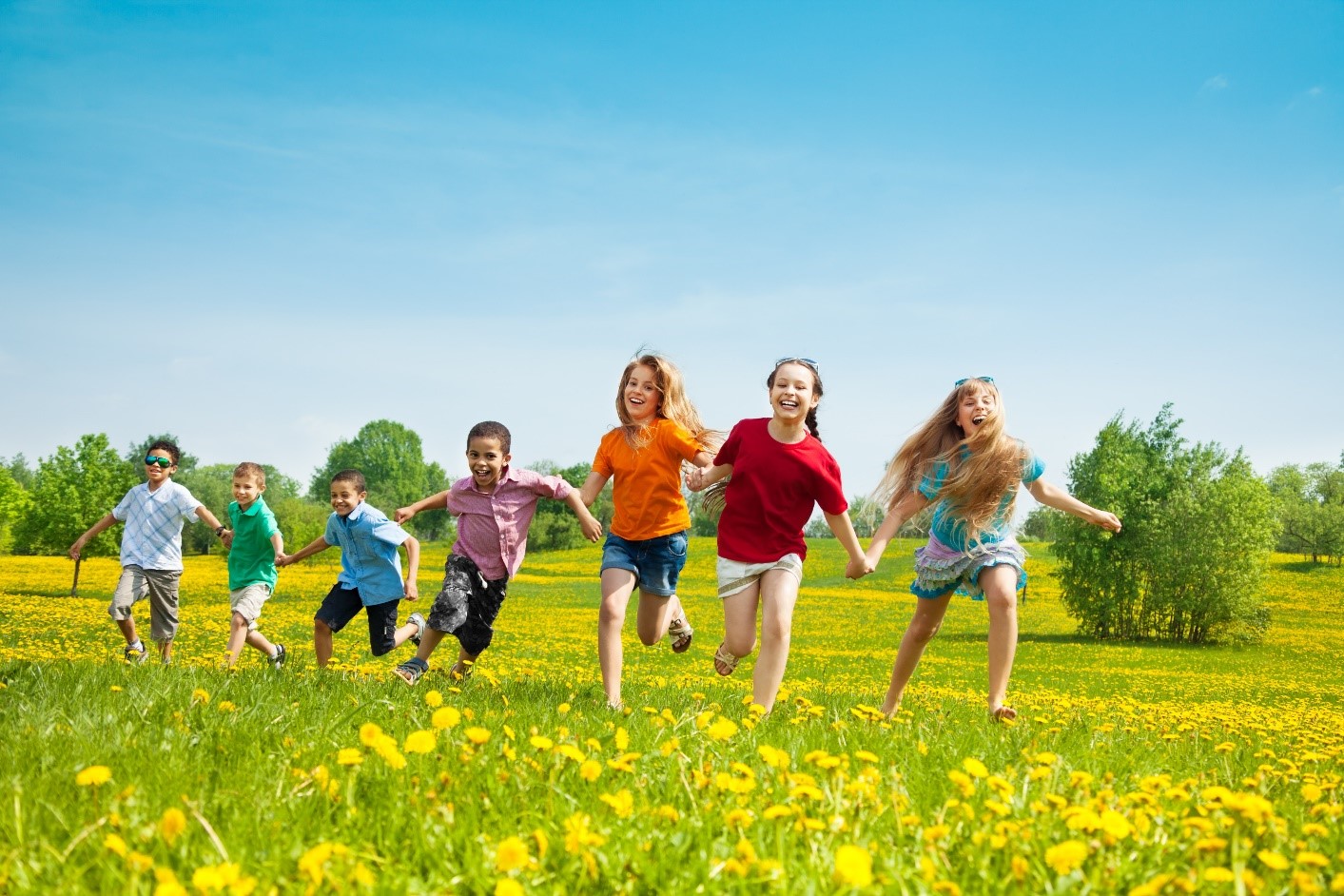 Kids running in a field.