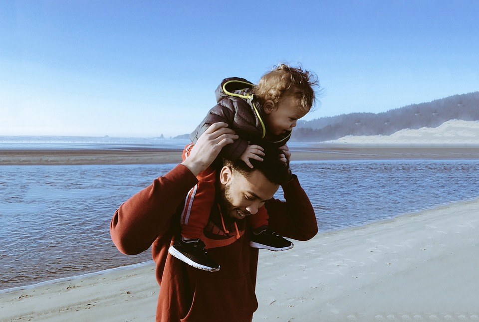 Father and child at beach