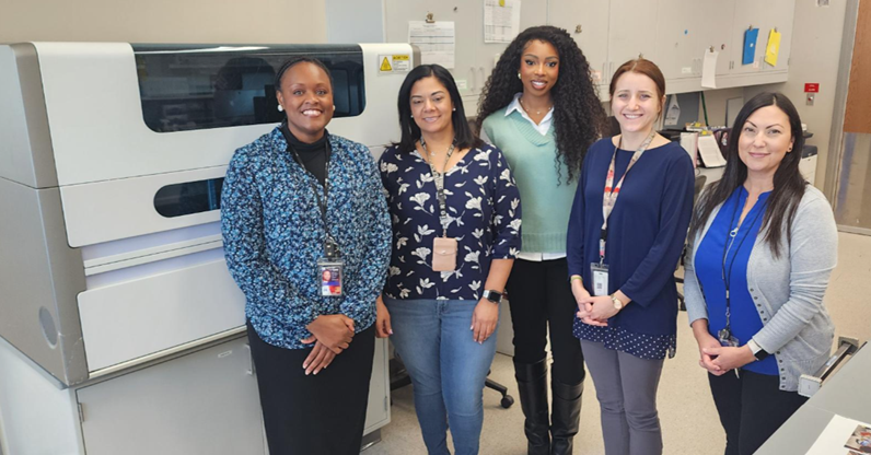 Lab Personnel taking a picture within the Laboratory area. 