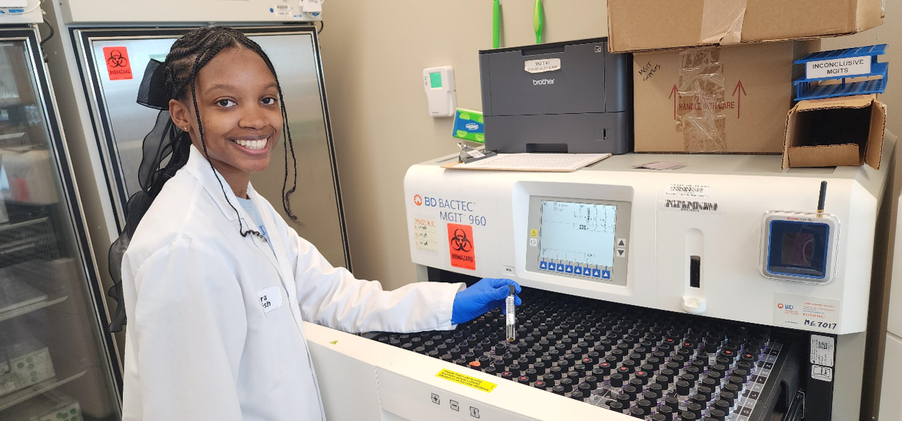 Loading samples onto the MGIT. Photo by DSHS, 2024