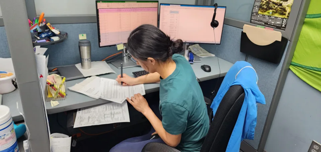 Lab technician writing 