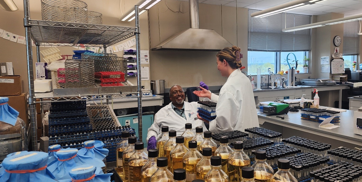 The Media Prep Team after dispensing broth into tubes and jars. Photo by DSHS, 2024