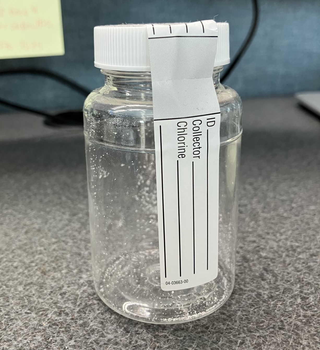 A clear plastic container with a white label