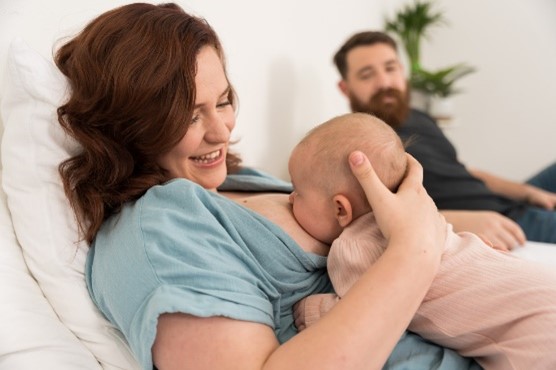 Mother breastfeeding her child.