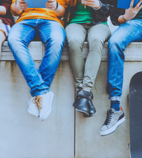 image of teenagers on wall