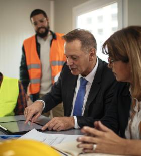 public safety workers in a meeting gathered around a table