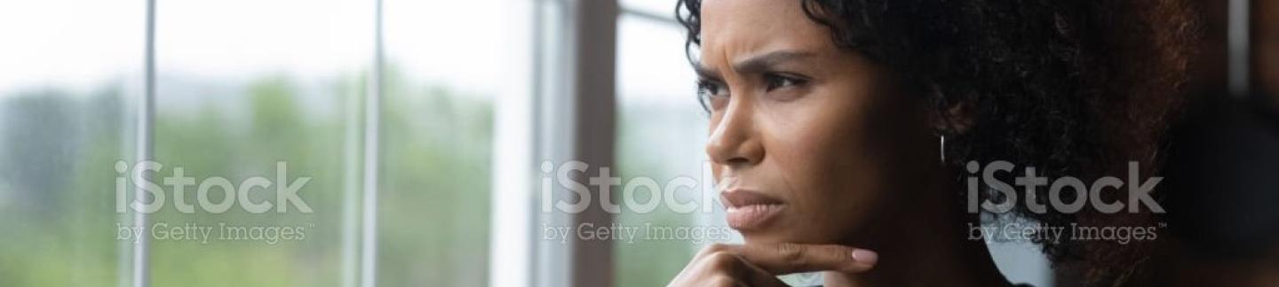 Woman looking out a window.