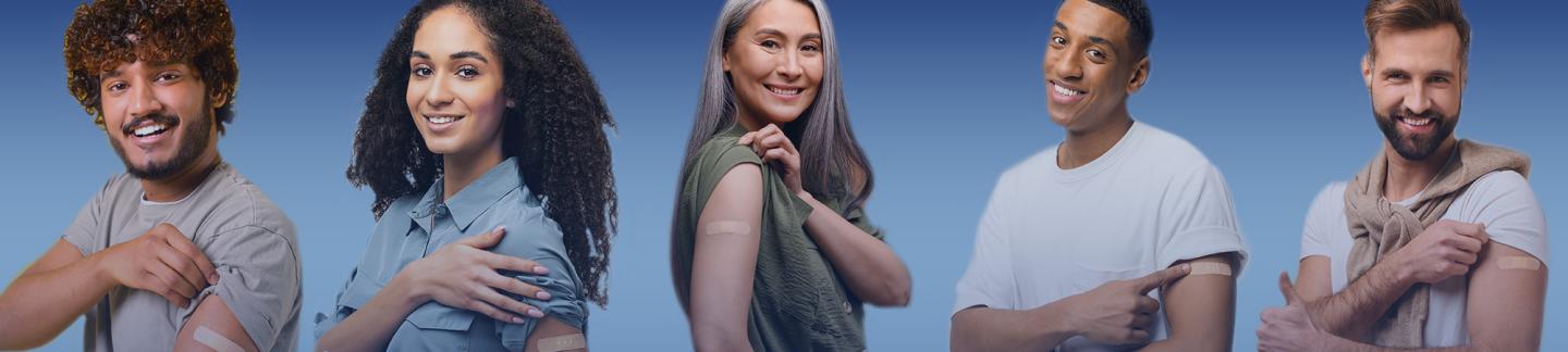 Five people standing in a row lifting their t-shirt sleeve to show a band-aid over where they received an immunization shot. 