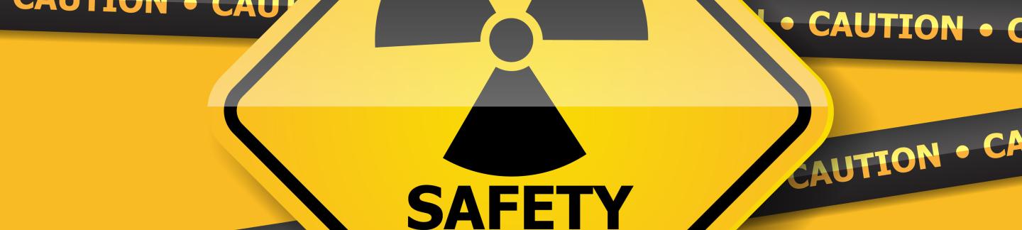 Radiation Warning Sign on a Yellow Wall