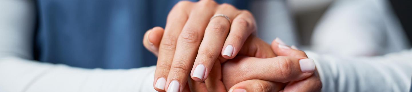 doctor holding a patient's hand