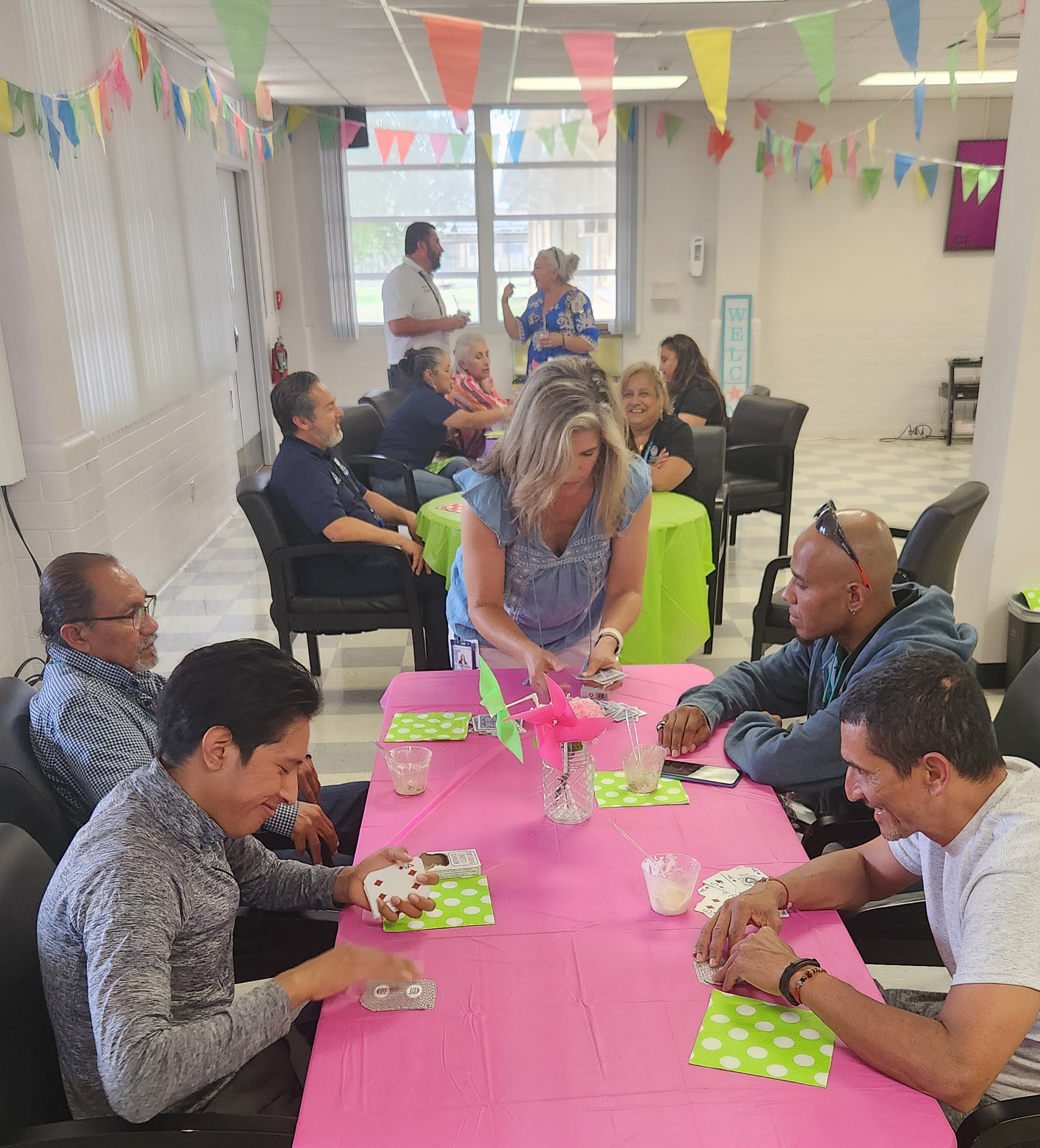 A group of patients playing games at a decorated table