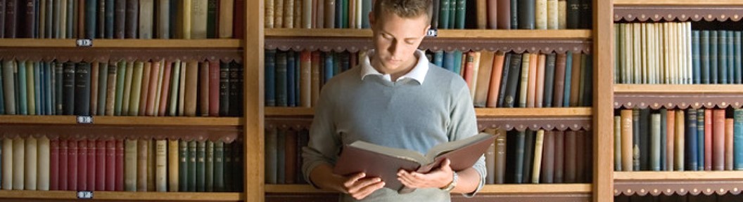 Image of a young man with an open book, decorative