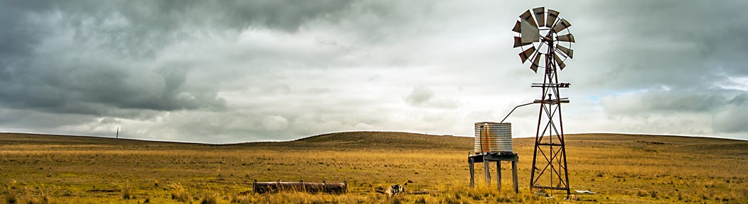 Landscape image, field under rainy clouds, decorative