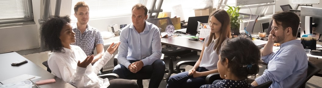 Image of people talking together, descriptive