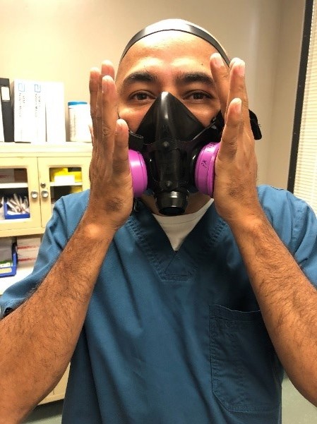 Respiratory Therapist conducts mask fit testing with a negative pressure test