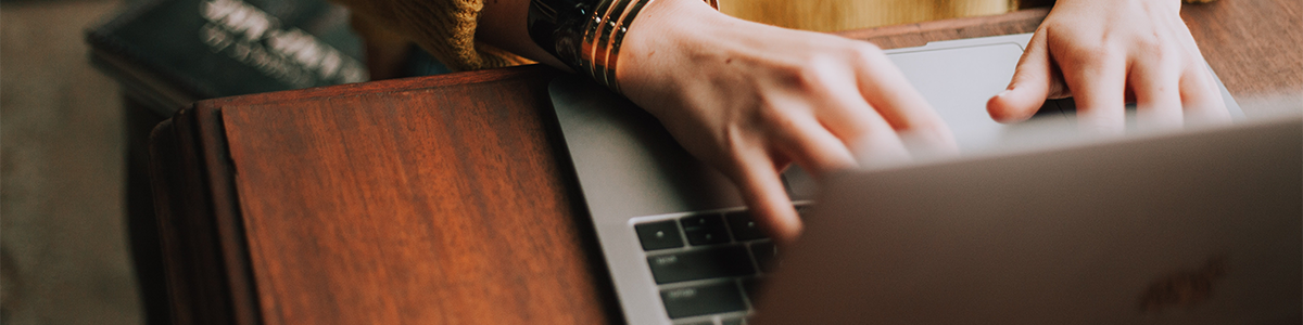 A woman works on a laptop.