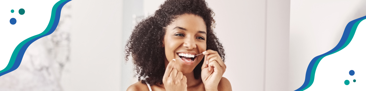 Person flossing teeth