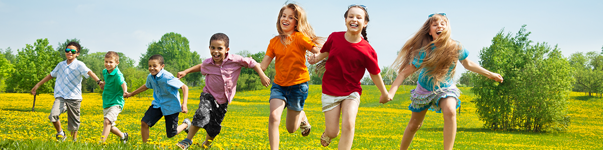 Children running through a field