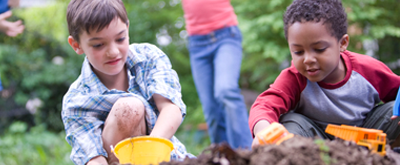"Children playing in dirt."