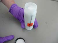 Place absorbent on tope of tubes and screw on plastic liner cap.